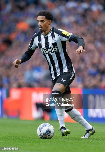 Jamal Lewis of Newcastle United in action during the pre-season friendly match between Rangers and Newcastle at Ibrox Stadium on July 18, 2023 in...