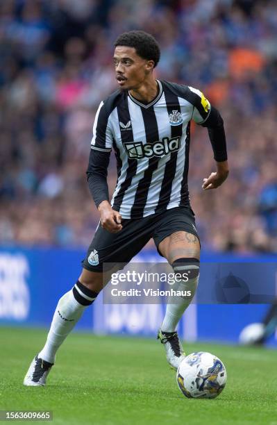 Jamal Lewis of Newcastle United in action during the pre-season friendly match between Rangers and Newcastle at Ibrox Stadium on July 18, 2023 in...