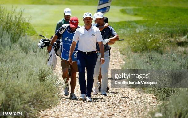 Justin Suh of the United States and Austin Cook of the United States walk from the 18th tee during the third round of the Barracuda Championship at...