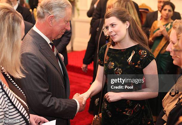 Prince Charles, Prince of Wales meets guests during his 64th birthday celebration who are also celebrating their birthday, at Government House on...