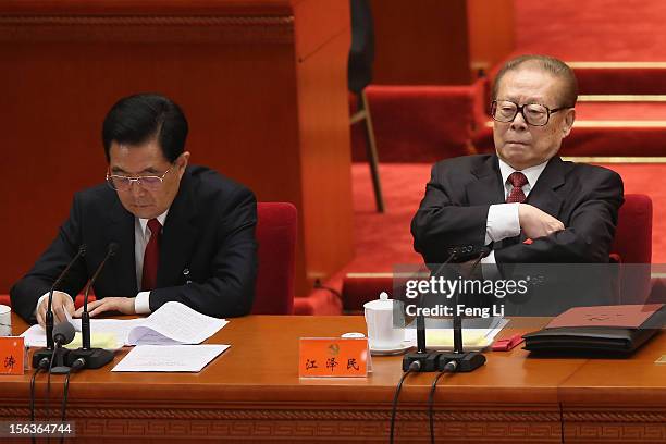 China's President Hu Jintao and former President Jiang Zemin attend the closing session of the 18th National Congress of the Communist Party of China...