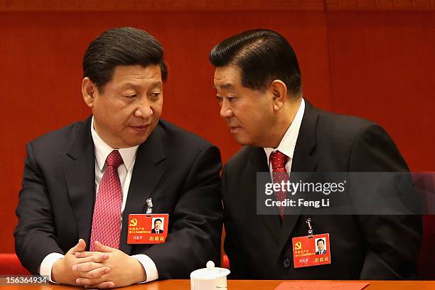 China's Vice President Xi Jinping and Chairman of the Chinese People's Political Consultative Conference Jia Qinglin talk during the closing session...