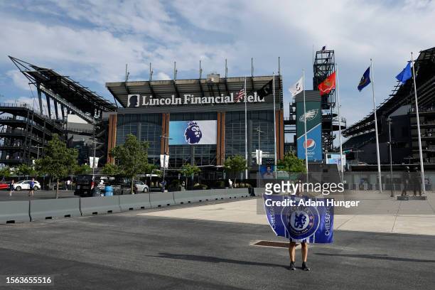 Fans pose outside the stadium prior to the pre season friendly match between Chelsea and Brighton & Hove Albion at Lincoln Financial Field on July...