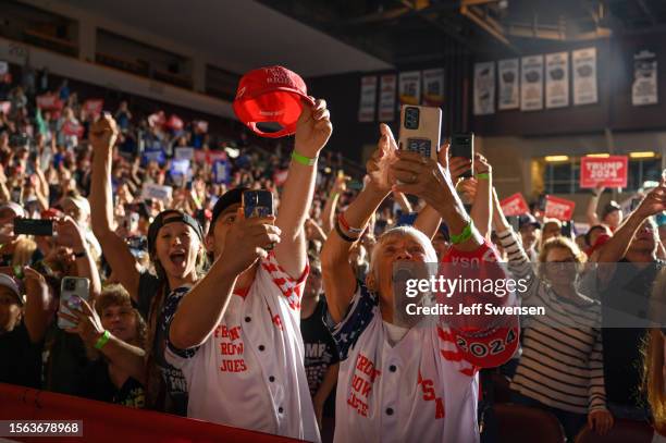 Trump supporters cheer as former U.S. President Donald Trump enters Erie Insurance Arena for a political rally while campaigning for the GOP...