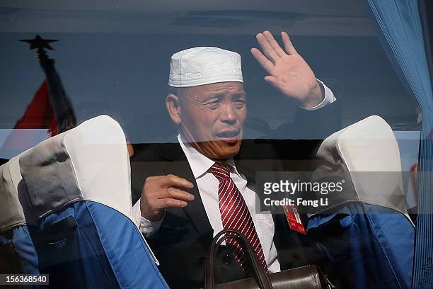 Delegate leaves the Tiananmen Square after the closing session of the 18th National Congress of the Communist Party of China on November 14, 2012 in...