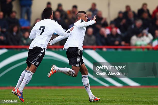 Kevin Akpoguma of Germany celebrates his team's second goal with team mate Jan Gyamerah during the U18 international friendly match between Germany...