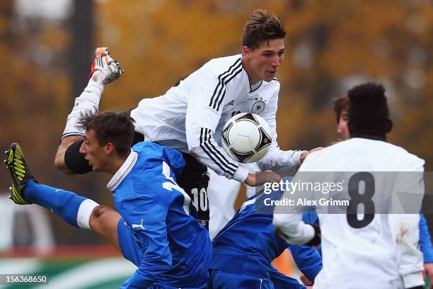 Niklas Stark of Germany is challenged by Alberto Rosa Gastaldo of Italy during the U18 international friendly match between Germany and Italy at...