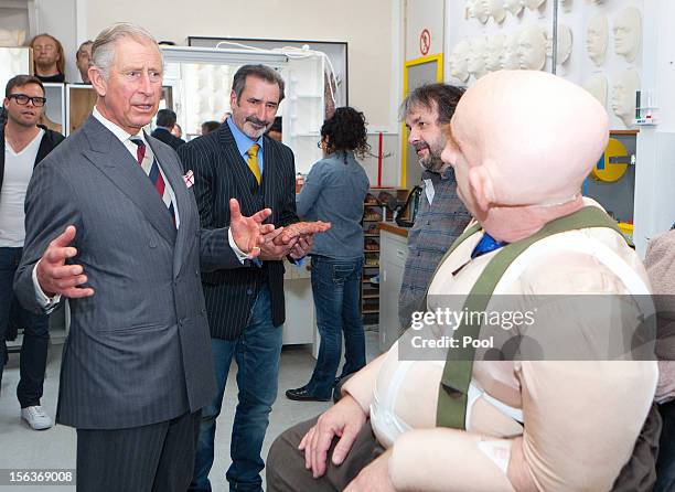 Prince Charles, Prince of Wales meets with Peter Hambleton, who plays the Dwarf Gloin in the new 'Hobbit' film, at Weta Workshop on November 14, 2012...