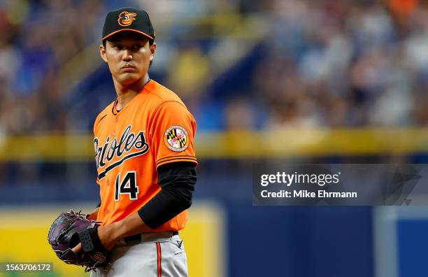 Shintaro Fujinami of the Baltimore Orioles pitches in the eighth inning during a game against the Tampa Bay Rays at Tropicana Field on July 22, 2023...