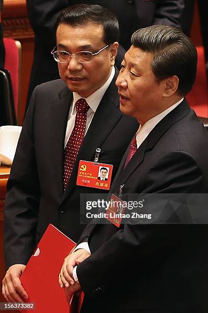 China's vice president Xi Jinping and Li Keqiang vice premier, prepare to leave the closing of the 18th Communist Party Congress at the Great Hall of...