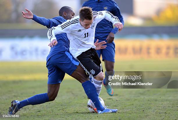 Jordan Ikoko of France challenges Thomas Pledl during the International Friendly match between U19 Germany and U19 France at Rheinstadium on November...