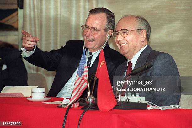 President George Bush shares a joke with Soviet leader Mikhail Gorbachev on December 03, 1989 on board the soviet cruise "Maxim Gorki", shipdocked at...