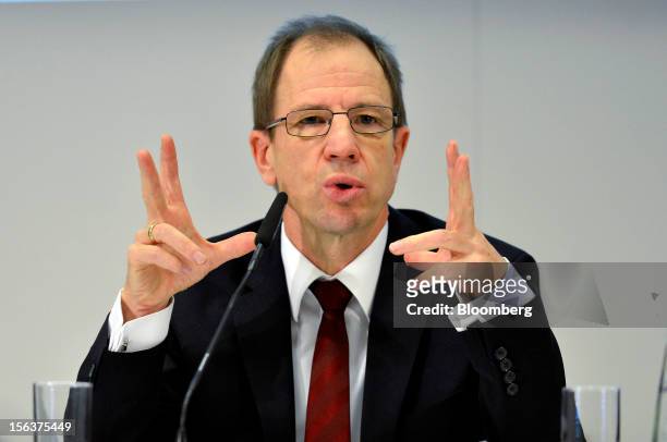 Reinhard Ploss, chief executive officer of Infineon Technologies AG, gestures as he speaks during the company's earnings news conference in Munich,...