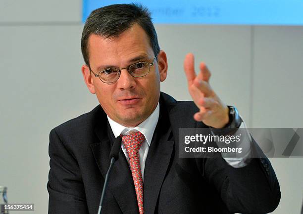 Dominik Asam, chief financial officer of Infineon Technologies AG, gestures as he speaks during the company's earnings news conference in Munich,...