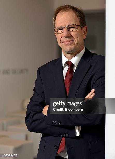 Reinhard Ploss, chief executive officer of Infineon Technologies AG, poses for a photograph following the company's earnings news conference in...