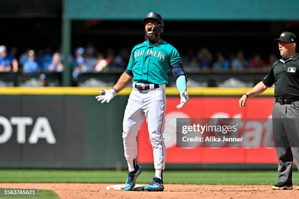 Teoscar Hernandez of the Seattle Mariners reacts after hitting a two-run RBI double against the Toronto Blue Jays at T-Mobile Park on July 22, 2023...