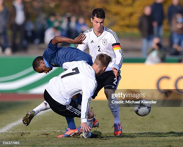 Lenny Nangis of France challenges against Yannick Gerhardt and Robin Yalcin during the International Friendly match between U19 Germany and U19...