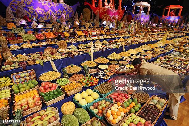 Food is placed on the main stage as Sadhus and Hindu men celebrate Diwali at the BAPS Shri Swaminarayan Mandir on November 14, 2012 in London,...