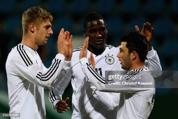 Lasse Sobiech of Germany celebrates the first goal with Peniel Mlapa and Tolgay Arslan during the U21 International Friendly match between Germany...