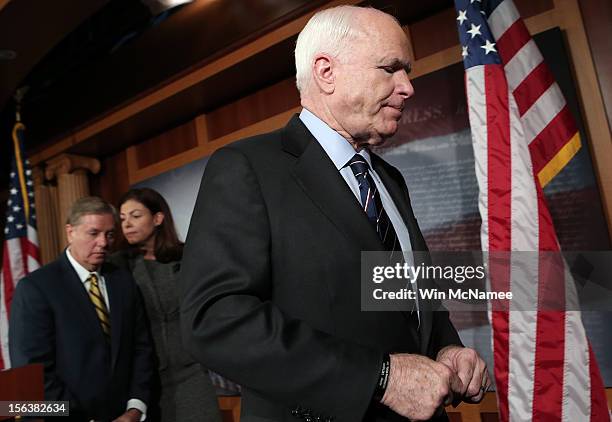 Sen. John McCain , Sen. Lindsey Graham , and Sen. Kelly Ayotte depart a news conference on the Benghazi terrorist attack at the U.S. Capitol November...