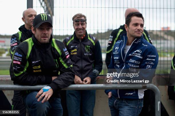 Cal Crutchlow of Great Britain and Monster Yamaha Tech 3 and Randy De Puniet of France and Power Electronics Aspar look on in pit during the second...