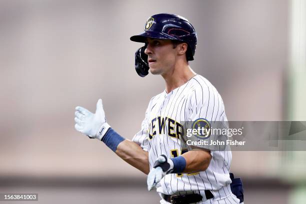Sal Frelick of the Milwaukee Brewers hits an infield single in his first major league at bat in the second inning Atlanta Braves at American Family...