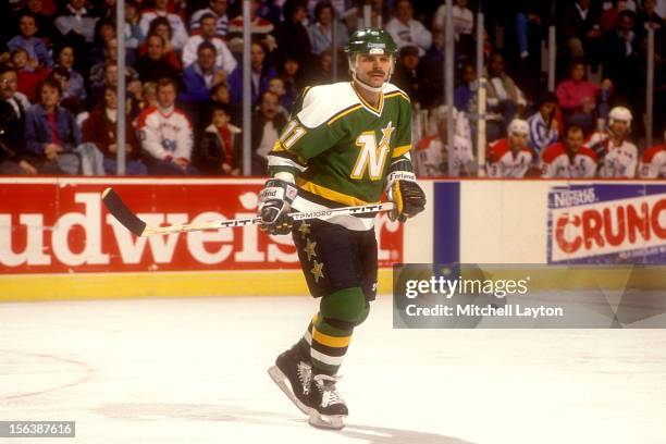 Mike Gartner of the Minnesota North Stars looks on during a hockey game against the Washington Capitals on February 11, 1990 at Capitol Centre in...