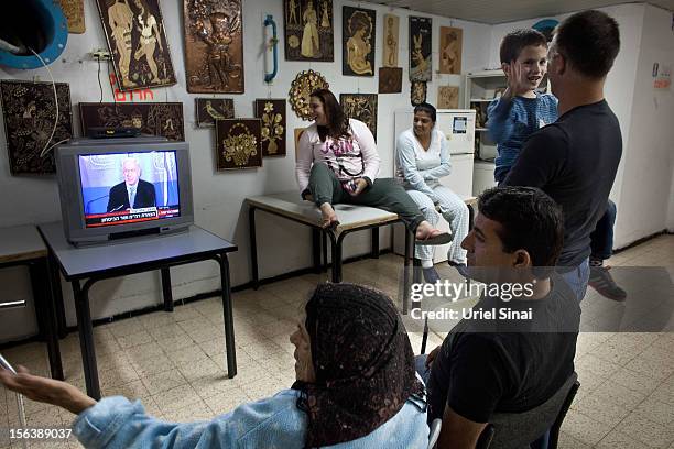 Israelis watch Israeli PM Benjamin Netanyahu on TV in a bomb shelter on November 14, 2012 in Netivot, Israel. Israel Defense Forces launched aerial...