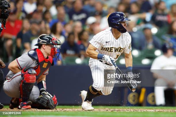 Sal Frelick of the Milwaukee Brewers singles in a run with his third hit of the game in the sixth inning against the Atlanta Braves at American...