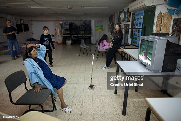 Israelis watch TV in a bomb shelter on November 14, 2012 in Netivot, Israel. Israel Defense Forces launched aerial attacks on targets in Gaza that...