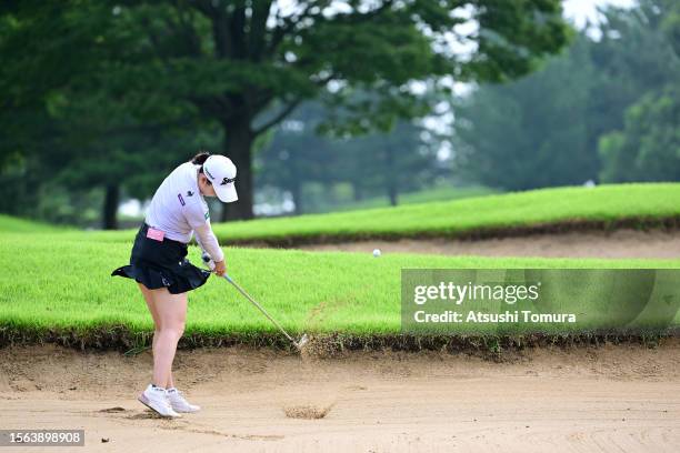 Sakura Koiwai of Japan hits out from a bunker on the 9th hole during the rest of third round of DAITO KENTAKU eheyanet Ladies at the Queen's Hill...
