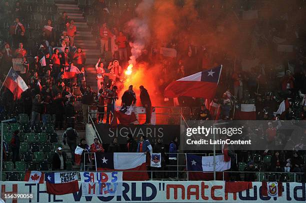 Fans of Chile cheer for their team during the FIFA Friendly match between Chile and Serbia at Arena Saint Gallen stadium on November 14, 2012 in...