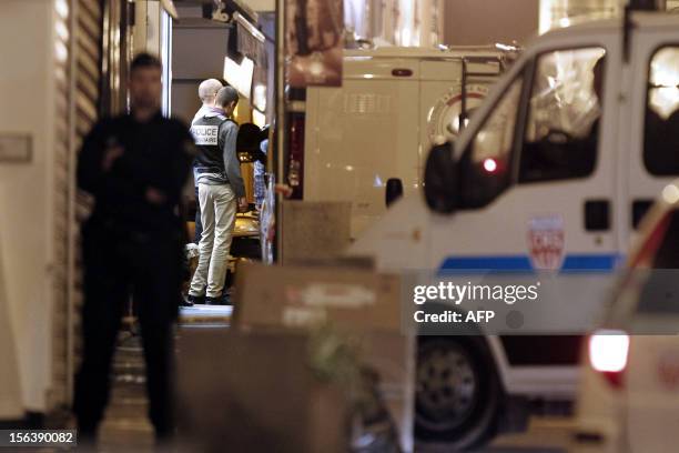 French policemen and forensics investigate around a crime scene where the Chamber of Commerce and Industry 's local president, Jacques Nacer was...