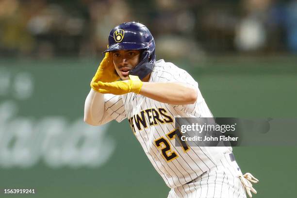 Willy Adames of the Milwaukee Brewers reacts after hitting a double in the eighth inning against the Atlanta Braves at American Family Field on July...