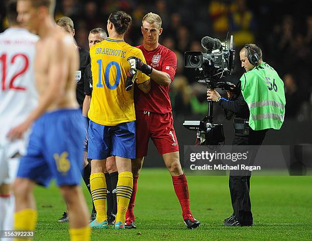 Zlatan Ibrahimovic of Sweden with Joe Hart of England after the international friendly match between Sweden and England at the Friends Arena on...