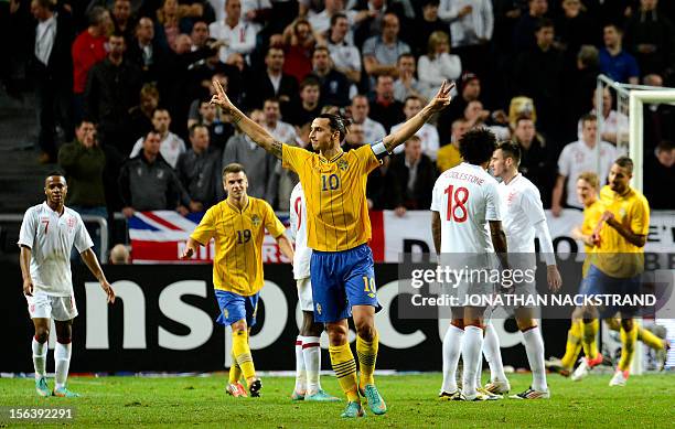 Sweden's striker and team captain Zlatan Ibrahimovic celebrates with his teammates after scoring his 3rd goal of the match during the FIFA World Cup...