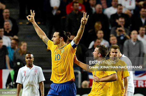 Sweden's striker and team captain Zlatan Ibrahimovic celebrates with his teammates after scoring his 3rd goal of the match during the FIFA World Cup...