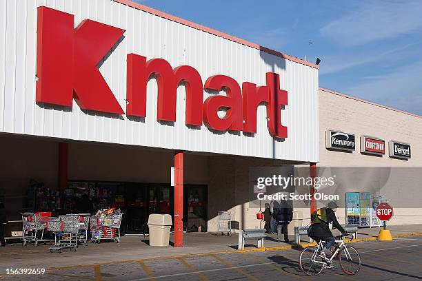 Customer leaves a Kmart store on November 14, 2012 in Chicago, Illinois. Sears Holdings , which owns Kmart, will report 3rd quarter earnings tomorrow...