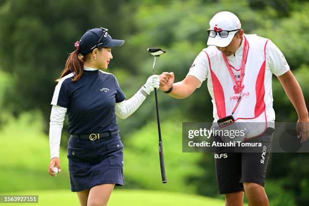 Hana Lee of South Korea fist bumps with her caddie after the birdie on the 6th green during the rest of third round of DAITO KENTAKU eheyanet Ladies...