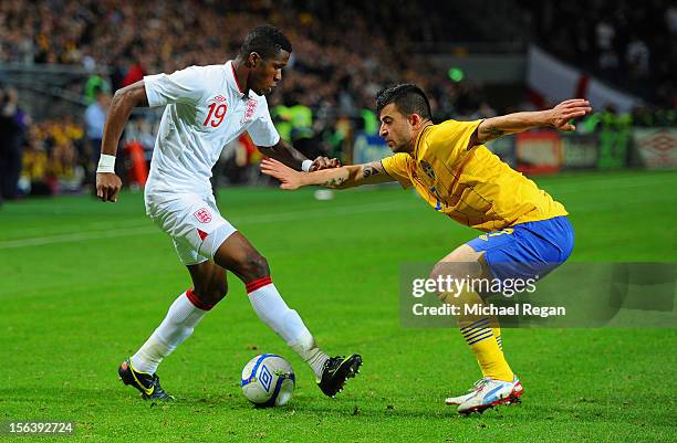 Wilfried Zaha of England in action with Behrangt Safari of Sweden during the international friendly match between Sweden and England at the Friends...