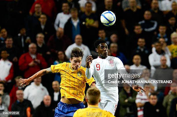 Sweden's defender Mikael Lustig vies with England's striker Danny Welbeck during the FIFA World Cup 2014 friendly match England vs Sweden in...