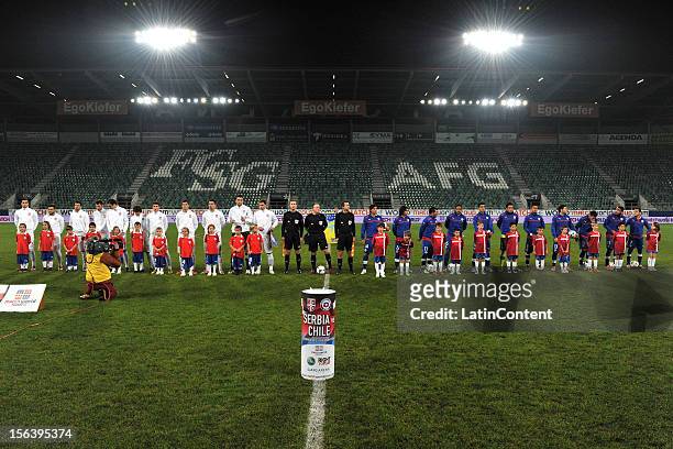 The Serbian team and the Chilean team pose for a photo prior to the FIFA Friendly match between Chile and Serbia at Arena Saint Gallen stadium on...