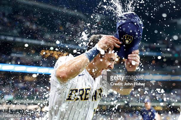 Sal Frelick of the Milwaukee Brewers gets a gatorade shower after the win against the Atlanta Braves at American Family Field on July 22, 2023 in...