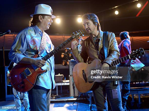 Recording artist Carlos Santana and singer/songwriter Juanes talk onstage during rehearsals for the 13th annual Latin GRAMMY Awards at the Mandalay...