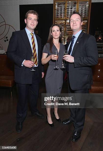 Captain Harris, Ellie Harris and Dylan Thomas show armed forces support at the 'Give Us Time' fundraiser held at Corinthia Hotel London on November...