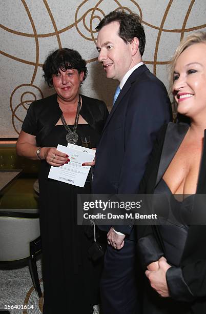 Denise Harris and George Osborne show armed forces support at the 'Give Us Time' fundraiser held at Corinthia Hotel London on November 14, 2012 in...