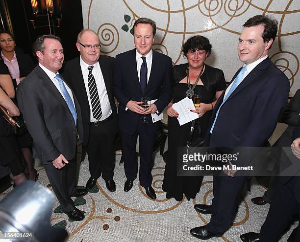 Dr. Liam Fox, Andy Harris, David Cameron, Denise Harris and George Osborne show armed forces support at the 'Give Us Time' fundraiser held at...