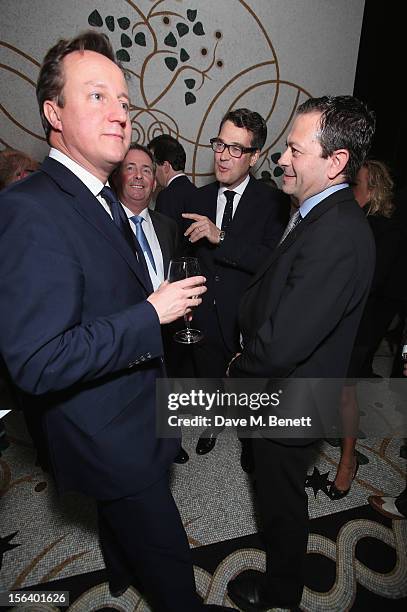 David Cameron, Dr. Liam Fox, Matthew Dixon and Simon Naudi show armed forces support at the 'Give Us Time' fundraiser held at Corinthia Hotel London...
