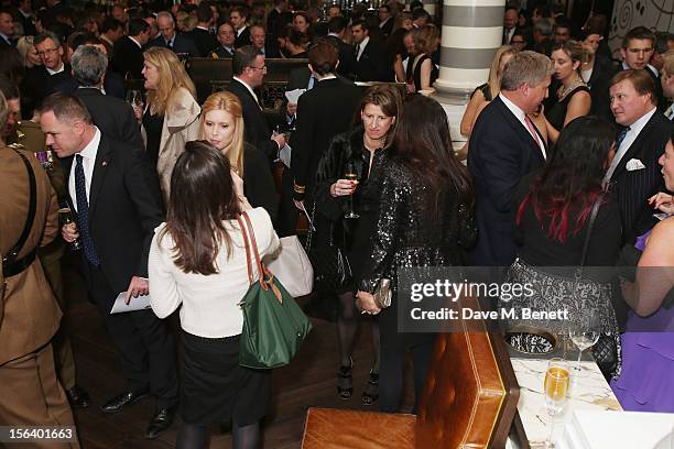 Atmosphere as guests show armed forces support at the 'Give Us Time' fundraiser held at Corinthia Hotel London on November 14, 2012 in London,...