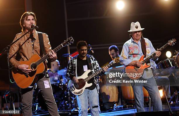 Singer/songwriter Juanes and recording artist Carlos Santana perform onstage during rehearsals for the 13th annual Latin GRAMMY Awards at the...